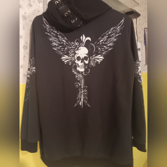 unknown Tops - Black Lace-Up Hoodie with White Wing Skull Design. Pre-loved Condition